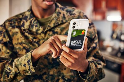 Military man texting on cell phone